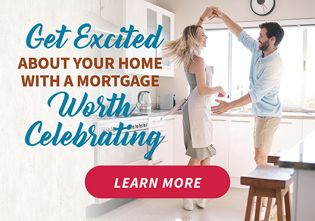 Image shows a young couple in their kitchen dancing together. Apply for MTFCU Mortgage today.