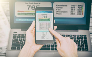 checking credit score on phone and computer