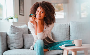 Lady holding new Members Trust Mastercard