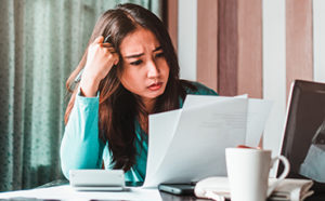 woman facing financial stresses
