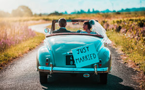 Just married couple driving off