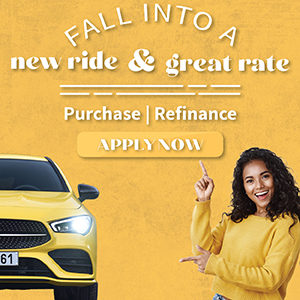 a woman pointing at a yellow car