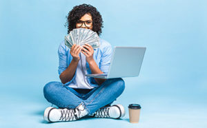 student holding money