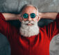 Santa Clause relaxing and wearing sunglasses