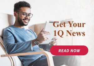 a man sitting in a chair holding a tablet