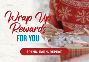 a person wrapping a package of silver objects